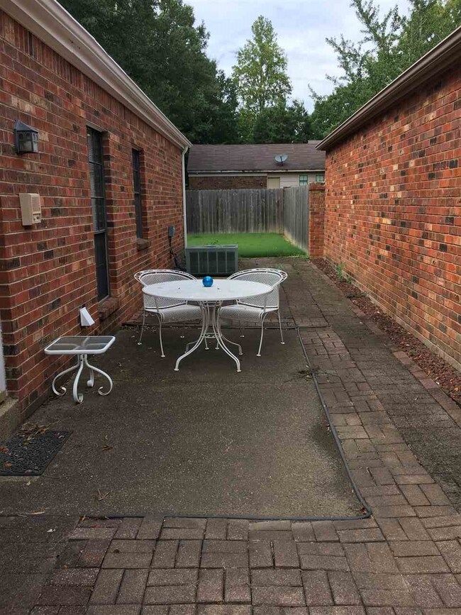 The bigger of the 2 patios.