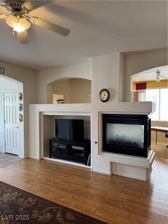 Unfurnished living room with hardwood / wood-style