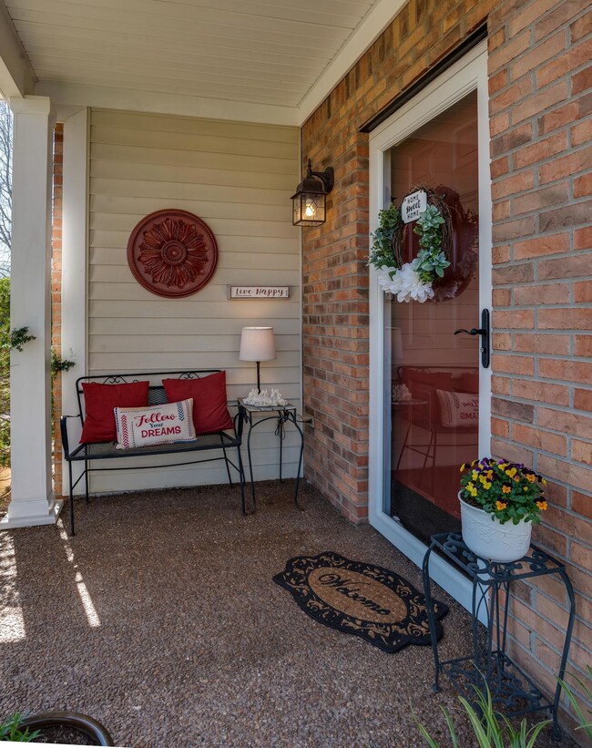 LOVELY FRONT PORCH AREA! WHAT A WAY TO WELCOME FRIENDS & FAMILY!