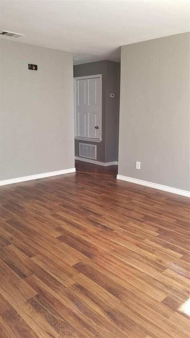 Living room. No carpet throughout unit. 