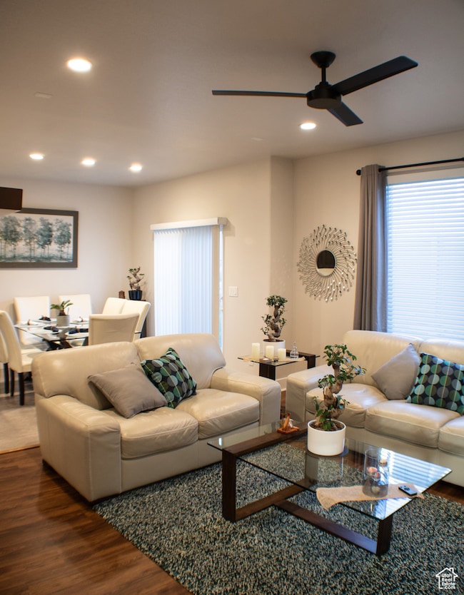 Living area with wood finished floors, recessed lighting, and a ceiling fan
