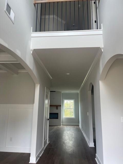 Corridor with arched walkways, ornamental molding,