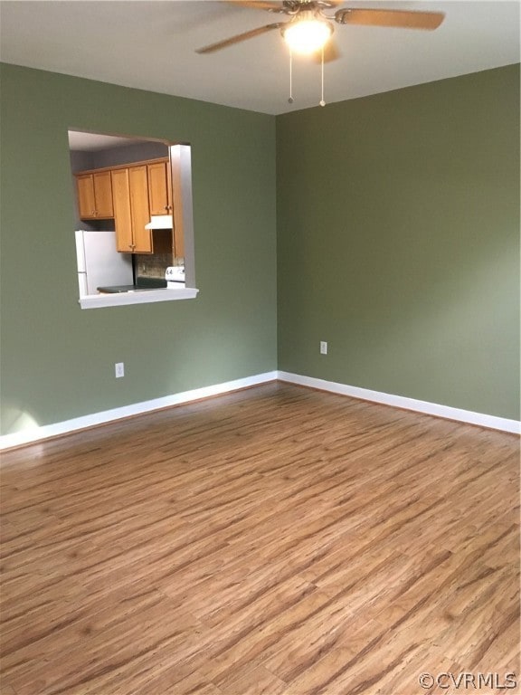 Another view of living room with serving window from kitchen.