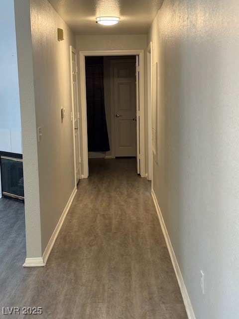 Corridor with carpet floors and baseboards