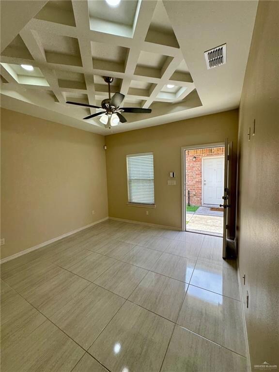 Additional view of tiled living room.