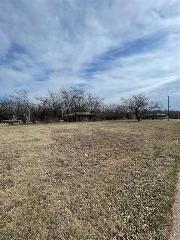 View of yard with a rural view