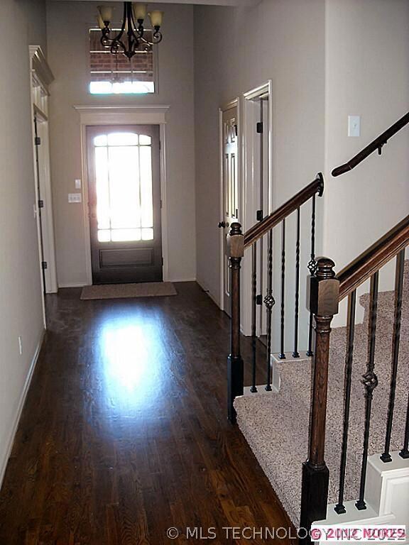 Foyer with wood floor, Study entry on left with Tr