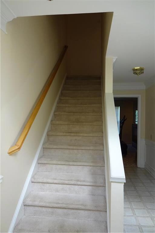 Enter lower level to rear is family room and laund
