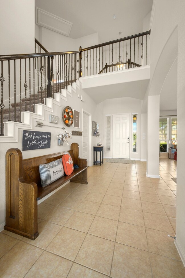 Stairway to 2nd floor with balcony open to the Den