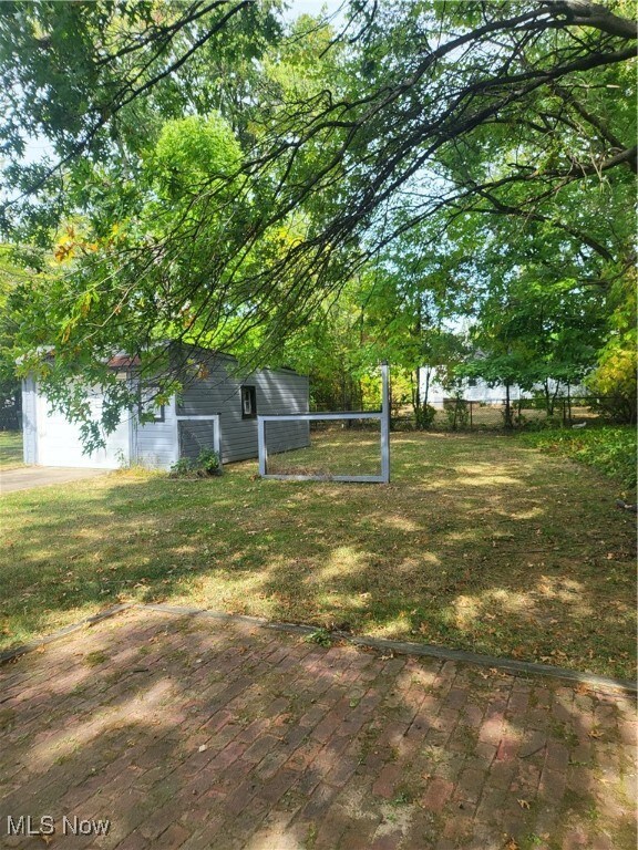 View of yard with a wooden deck
