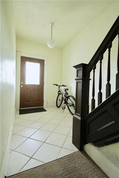 Entry hall to house providing access to both units