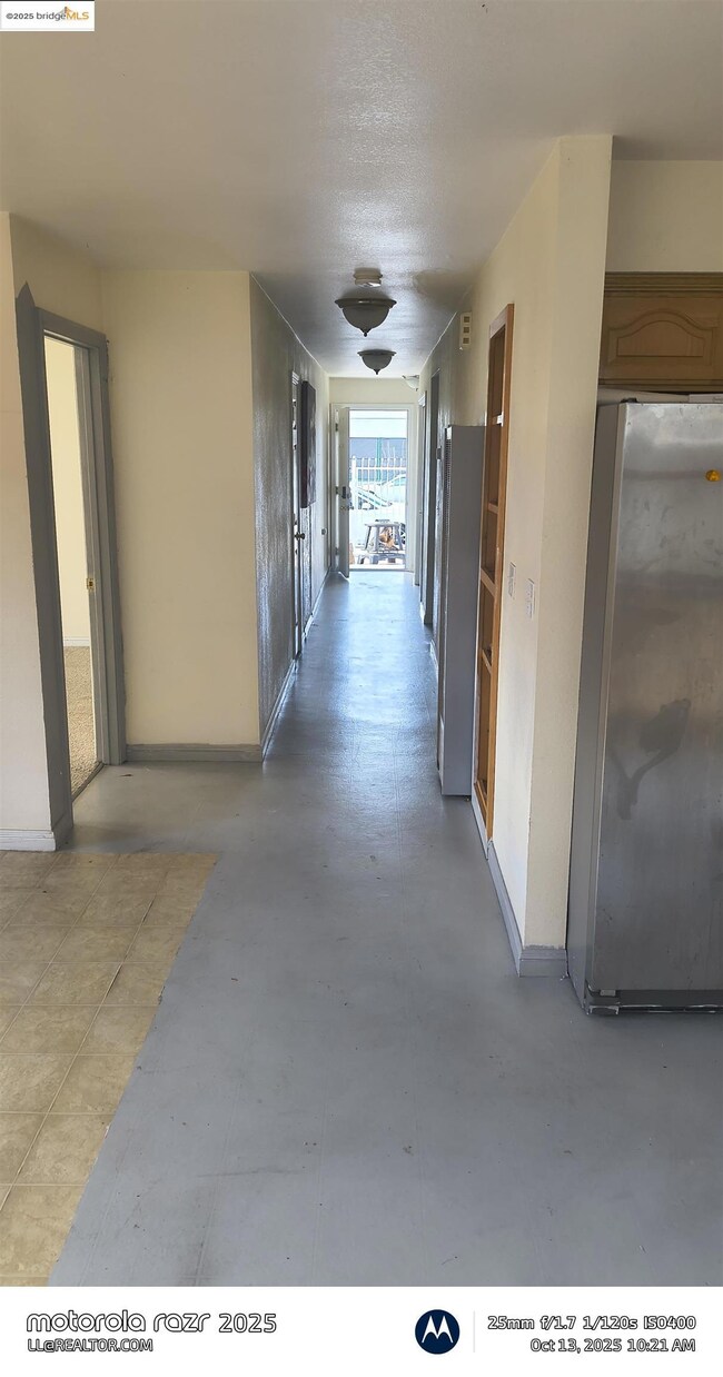 Hallway featuring baseboards