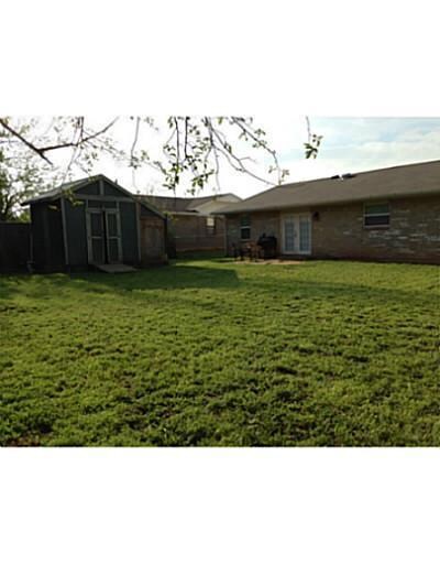 Exterior Back. Large backyard with workshop/shed.