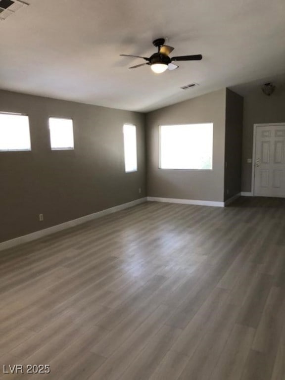 Living room featuring lofted ceiling, vinyl plank