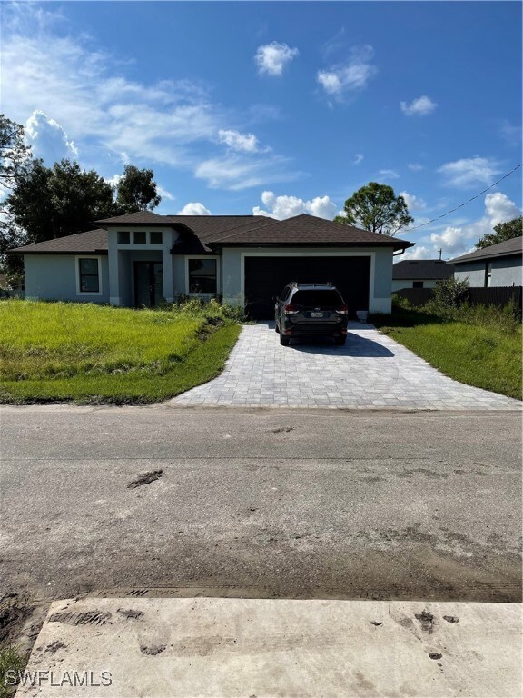 View of front of home featuring a garage