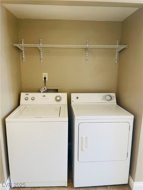 Laundry area featuring separate washer and dryer