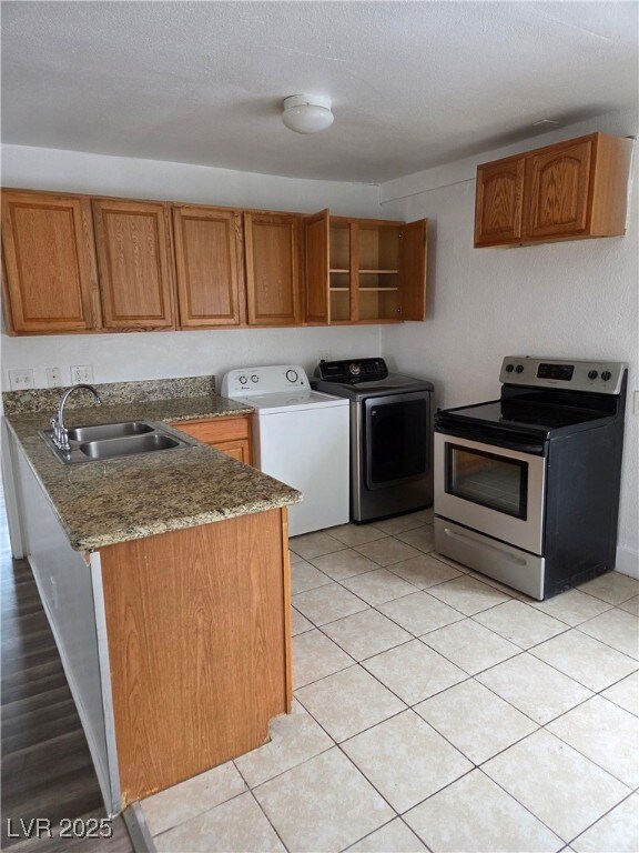 Kitchen featuring stainless steel electric range,
