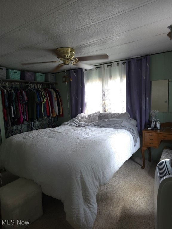 Bedroom featuring carpet and a ceiling fan