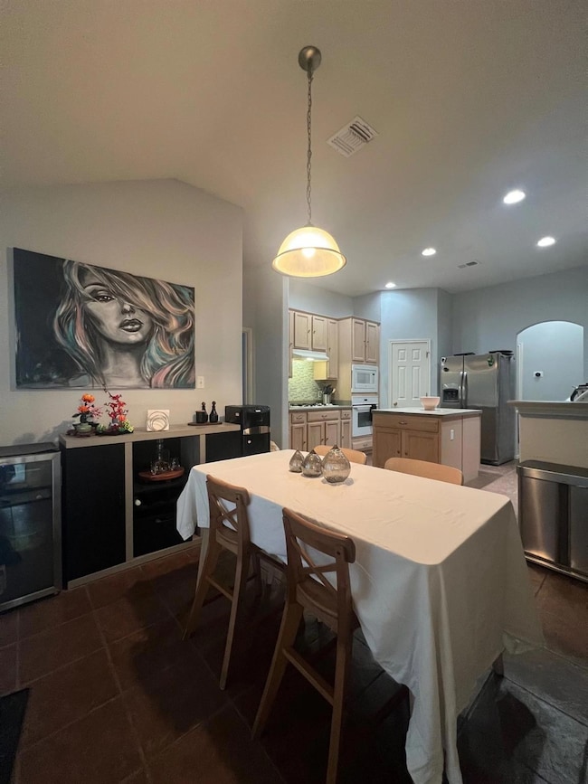Dining area with recessed lighting, beverage cool