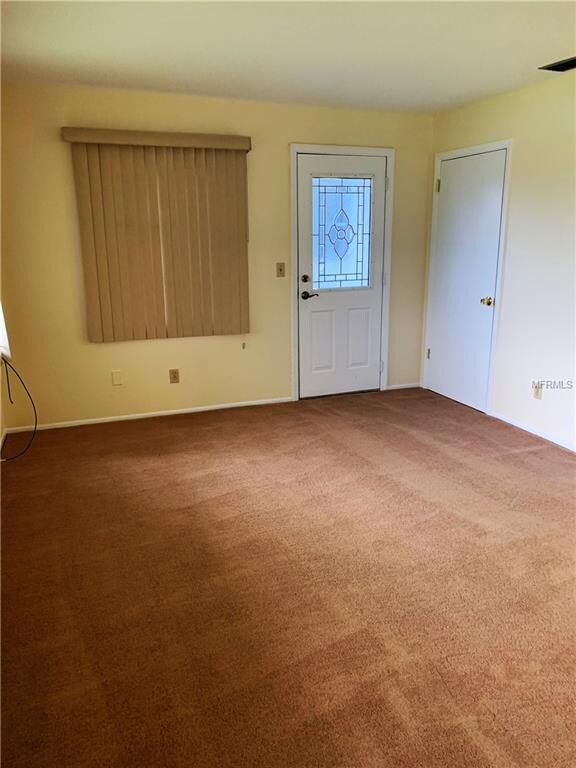 Florida room towards back door and laundry room