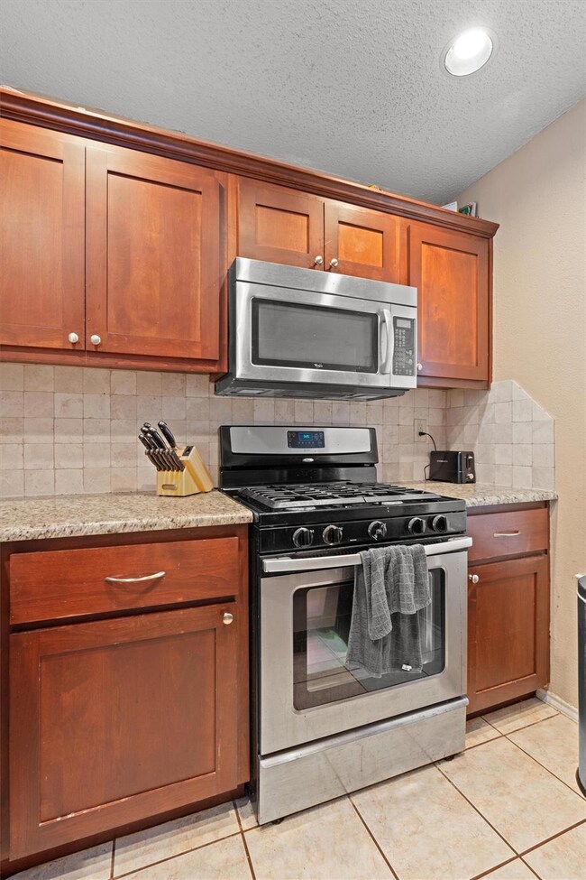 Kitchen featuring appliances with stainless steel