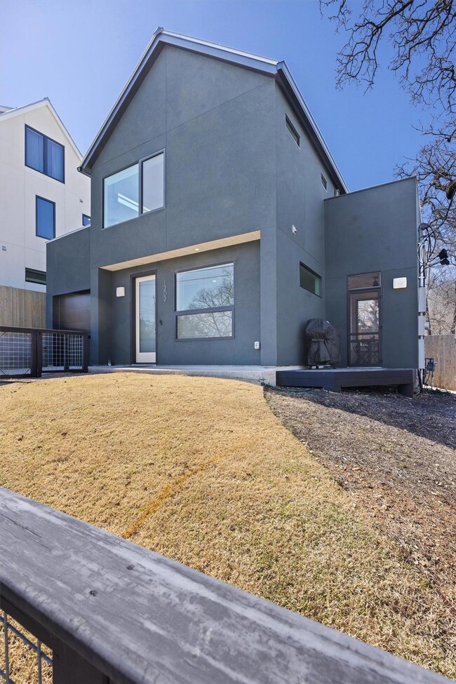View of front facade featuring stucco siding and 