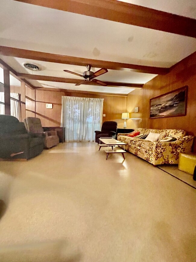 spacious family room with sliding doors to outdoor