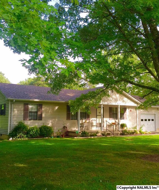 Beautiful country setting on a large lot with mature trees