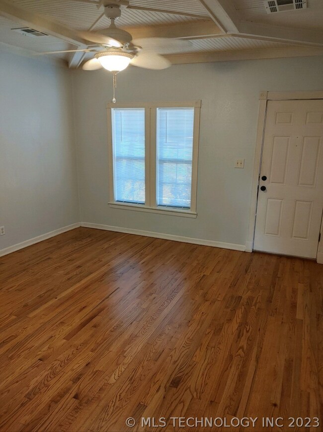 Living area looking back to front door.