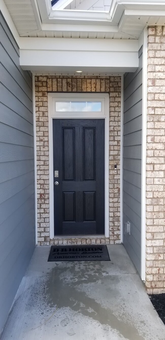 Front covered entry with video doorbell.