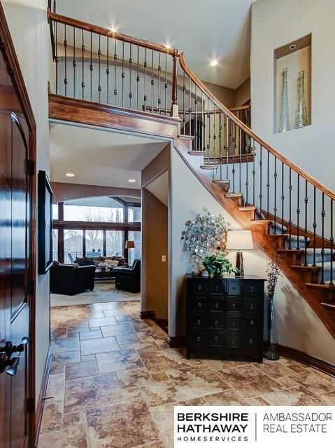 10209 S 164 St  Tiled floor open staircase to 2nd floor balcony.