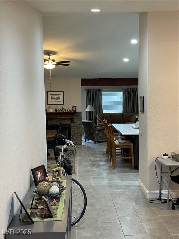 Hall featuring tile patterned floors, recessed lig