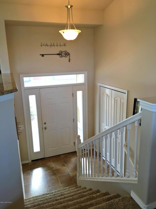 Spacious foyer with coat closet