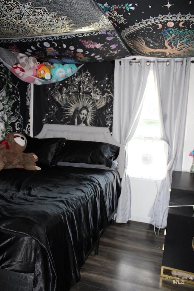 Bedroom featuring wood finished floors