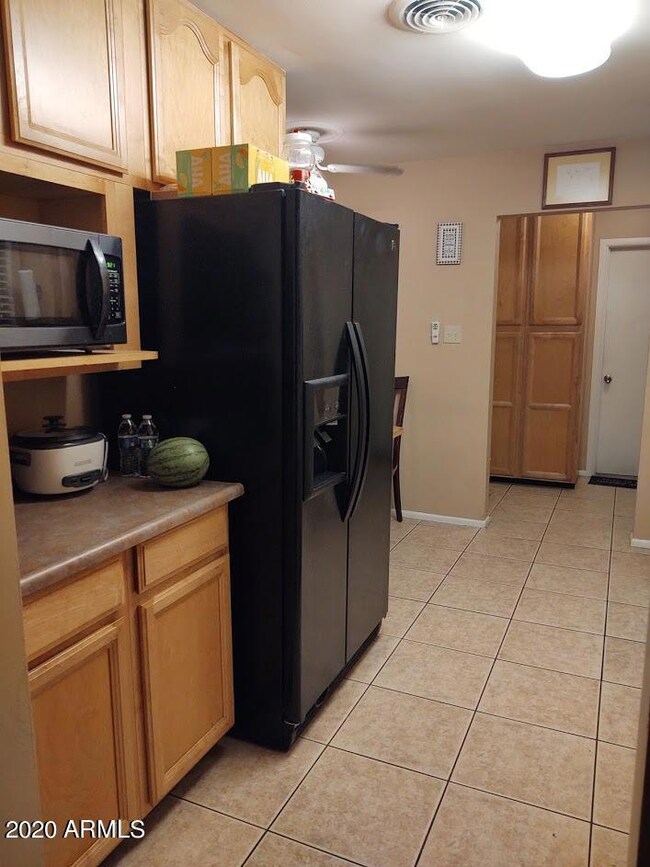 Kitchen showing frig that stays