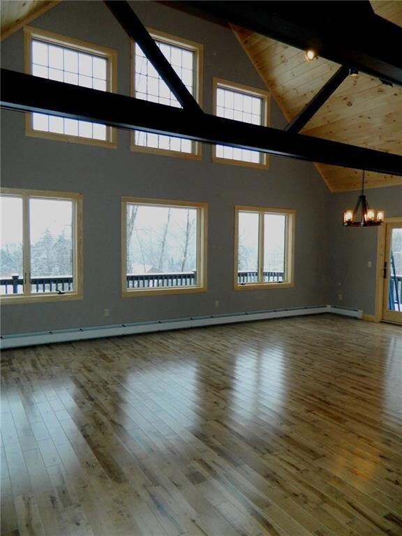 Open living area with hardwood flooring.
