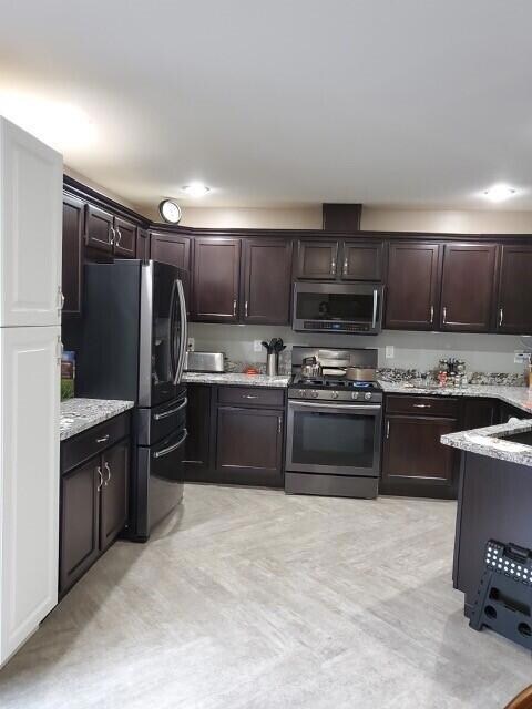 Kitchen w/dining area opening onto deck.