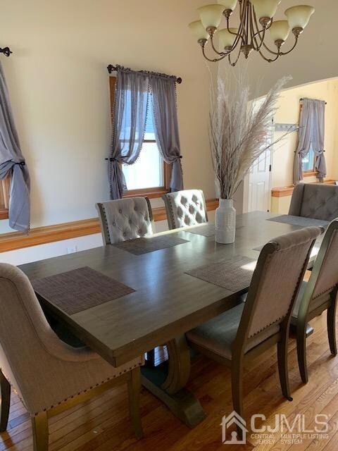 Formal dining room with plenty of natural light and  neutral color tone creating a soft formal feel.