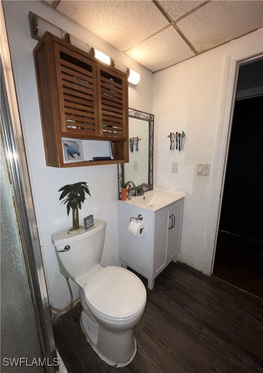 Bathroom with hardwood / wood-style floors, toilet