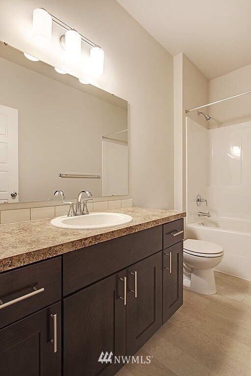 Main floor full bathroom. PHOTOS/RENDERINGS ARE FOR ILLUSTRATION ONLY. This is a general representation of floor plan. Photos are not of actual home and may vary from actual home constructed. Features & colors in photos, upgrades, elevation, materials, dimensions and layout all subject to change without notice.