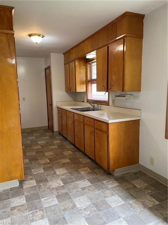 Kitchen 14 x7 with new vinyl flooring, faucet and 
