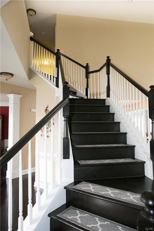 Gorgeous espresso stained curved staircase.
