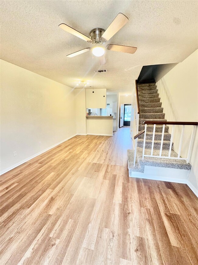 Unfurnished living room with light wood-type floor