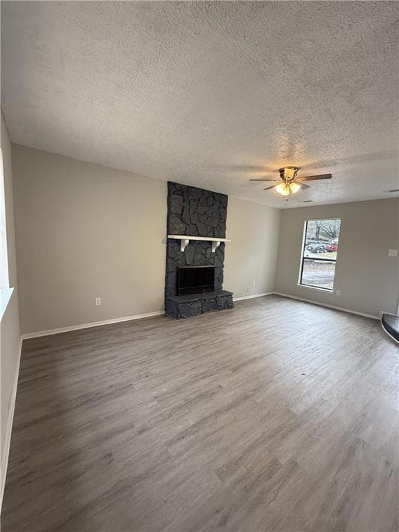 Unfurnished living room with a textured ceiling, a