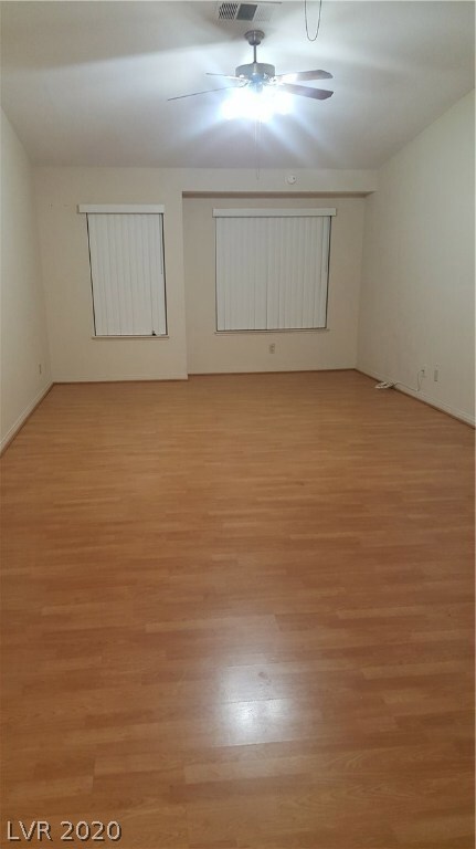 formal living room with windows facing the street