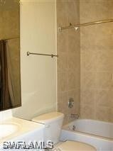 Bathroom featuring toilet, bathing tub / shower co