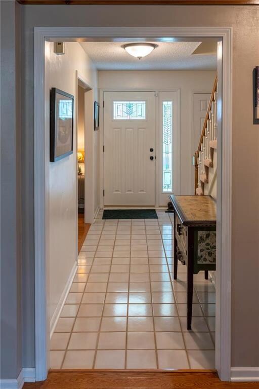 A large foyer and bright living area cheerfully we