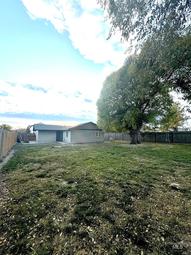 View of fenced backyard