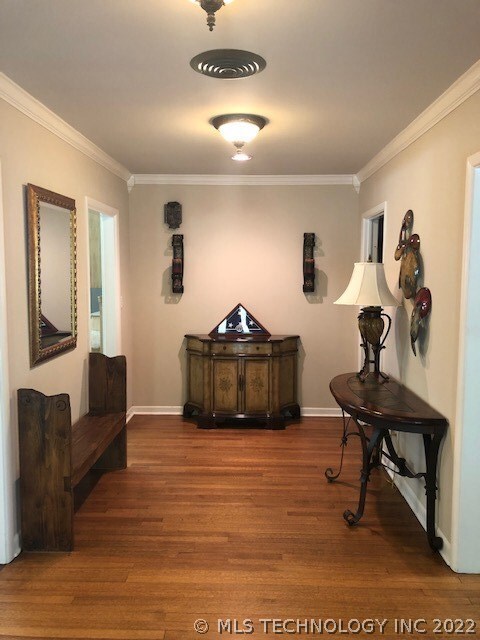 Beautiful wide entry with hardwood floors.