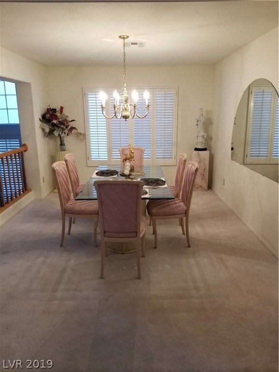 Formal dining room with shutters